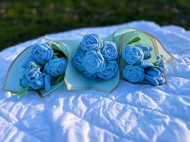 Handmade knitted blue flower bouquets